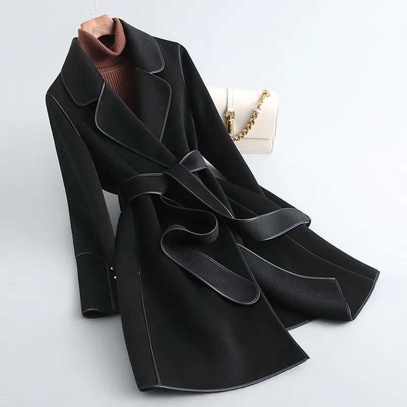 Women's belted trench coat with notched lapels, contrast piping and long sleeves