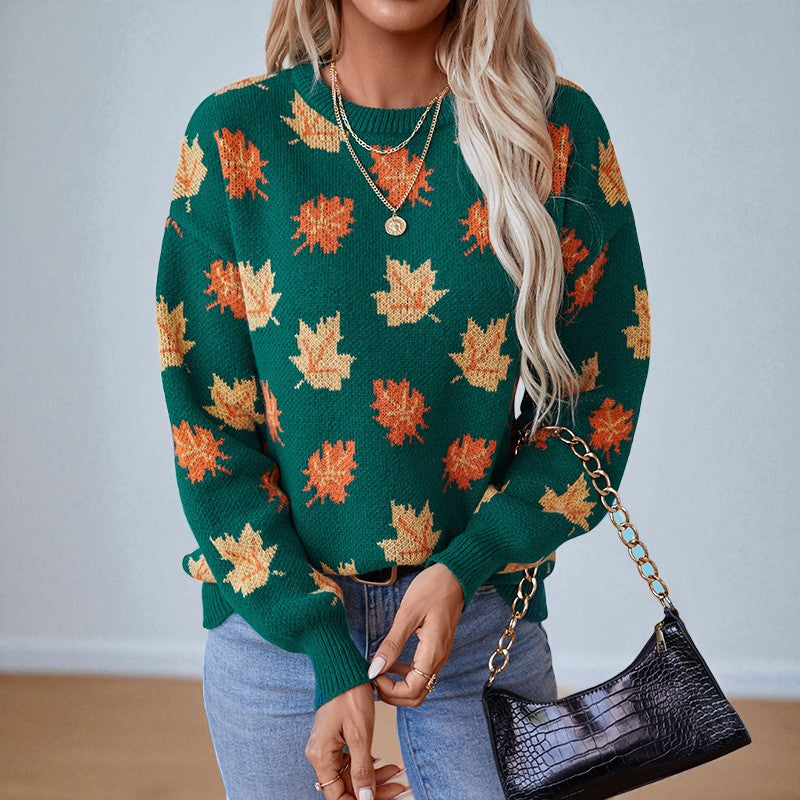 Women's crew neck sweater with repeated maple leaf pattern and long sleeves