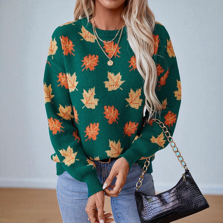 Women's crew neck sweater with repeated maple leaf pattern and long sleeves