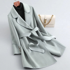 Women's belted trench coat with notched lapels, contrast piping and long sleeves
