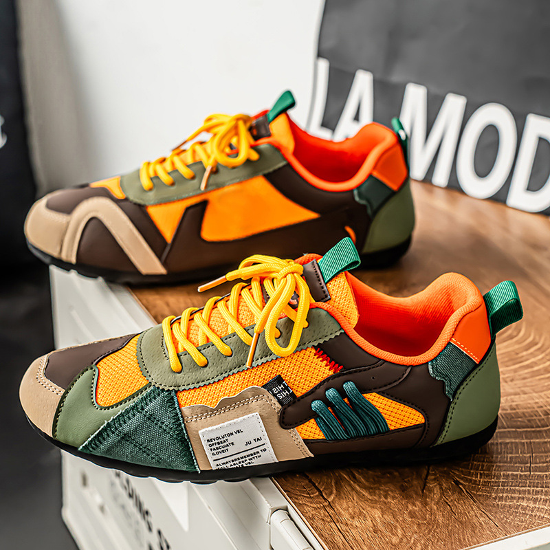 Colourblock utility trainers with layered panels and lace-up fronts
