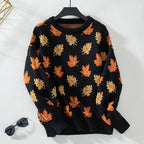Women's crew neck sweater with repeated maple leaf pattern and long sleeves