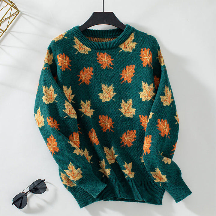 Women's crew neck sweater with repeated maple leaf pattern and long sleeves