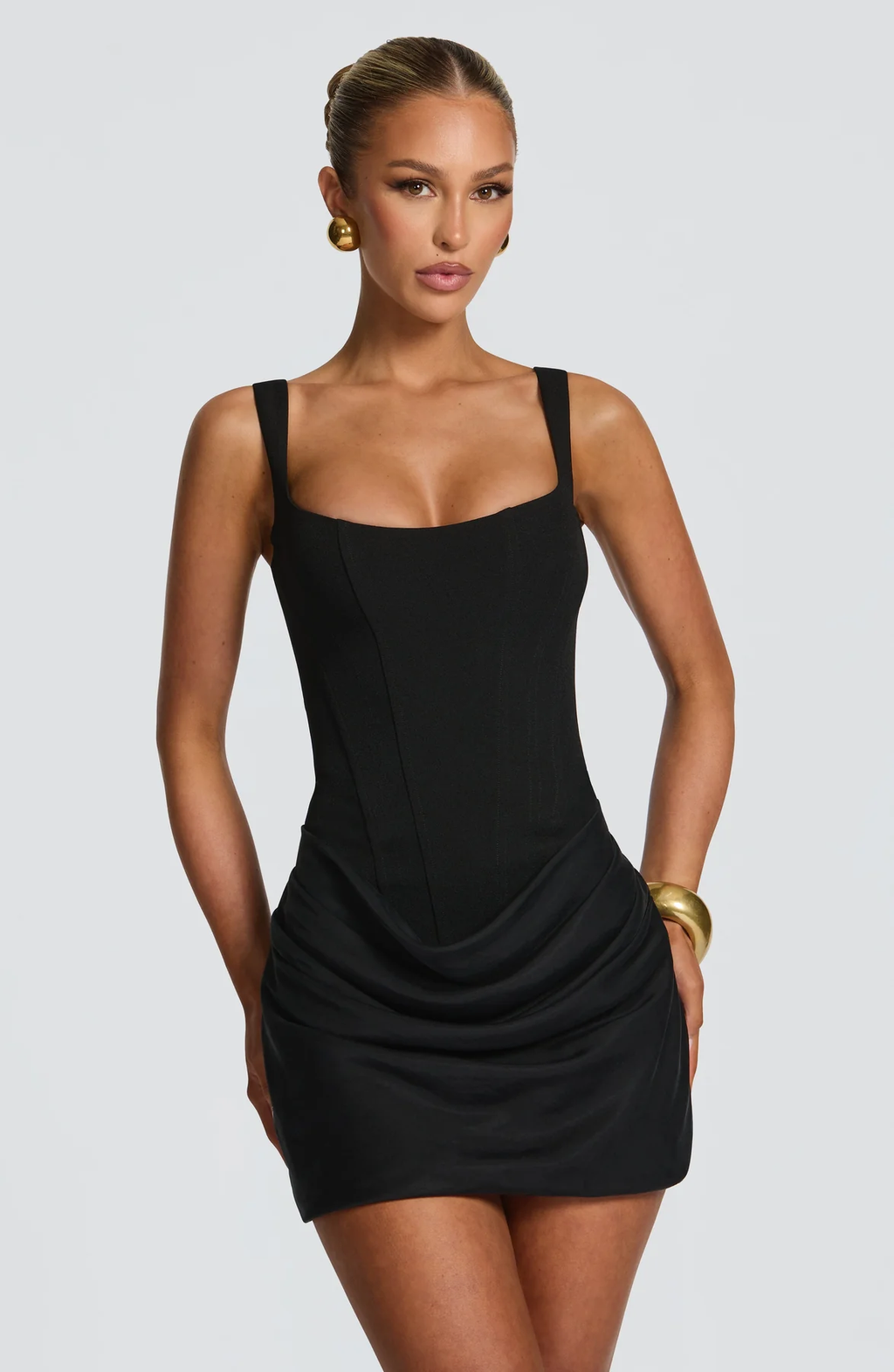 Women's sleeveless square-neck mini dress with a fitted bodice and draped ruched skirt