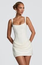 Women's sleeveless square-neck mini dress with a fitted bodice and draped ruched skirt