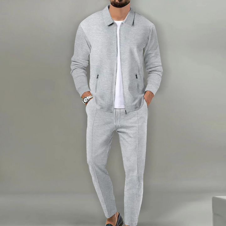 Men's two-piece textured tracksuit set with zip jacket and tapered trousers
