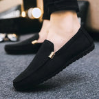 Men's slip-on loafers with gold-tone metal detail and flat sole