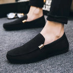 Men's slip-on loafers with gold-tone metal detail and flat sole