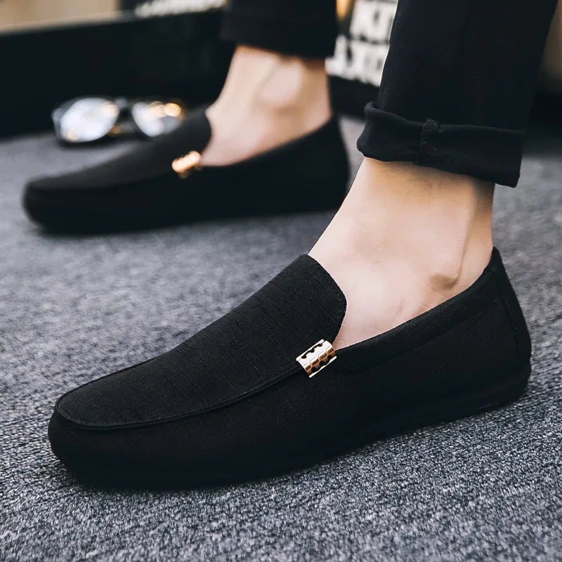 Men's slip-on loafers with gold-tone metal detail and flat sole