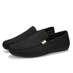 Men's slip-on loafers with gold-tone metal detail and flat sole
