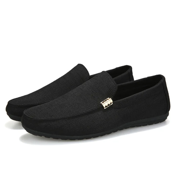 Men's slip-on loafers with gold-tone metal detail and flat sole