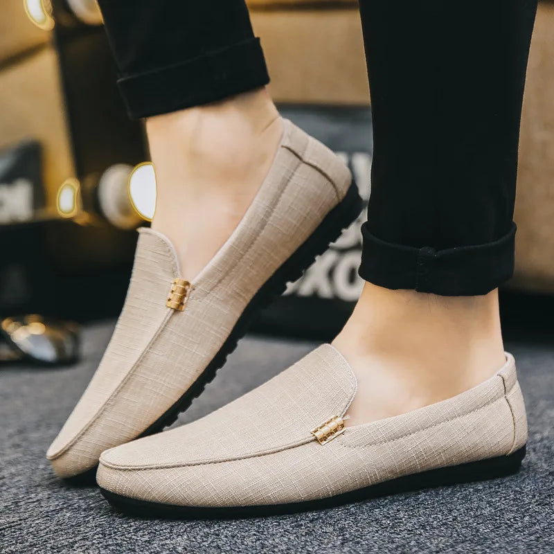 Men's slip-on loafers with gold-tone metal detail and flat sole