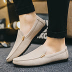 Men's slip-on loafers with gold-tone metal detail and flat sole