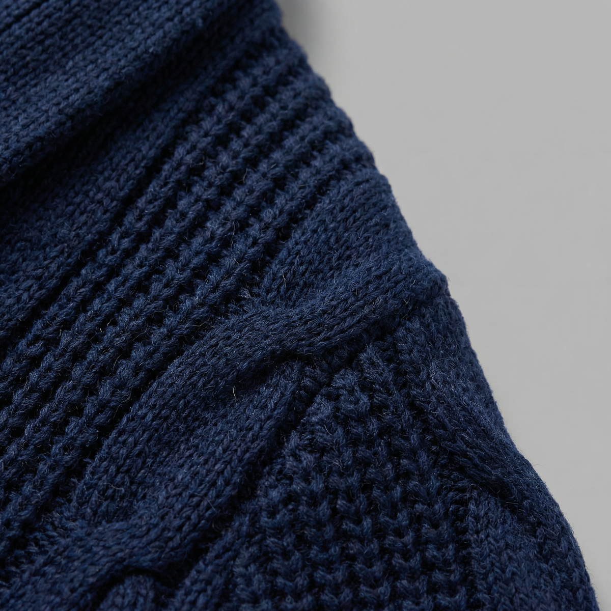 Men's cable knit cardigan with shawl collar and button front