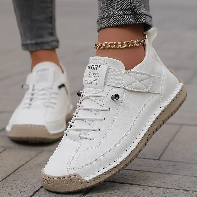 Women's ankle-collar lace-up sneakers with stitched panels and textured flat soles