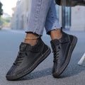 Women's lace-up casual sneakers with ankle strap and stitched panels