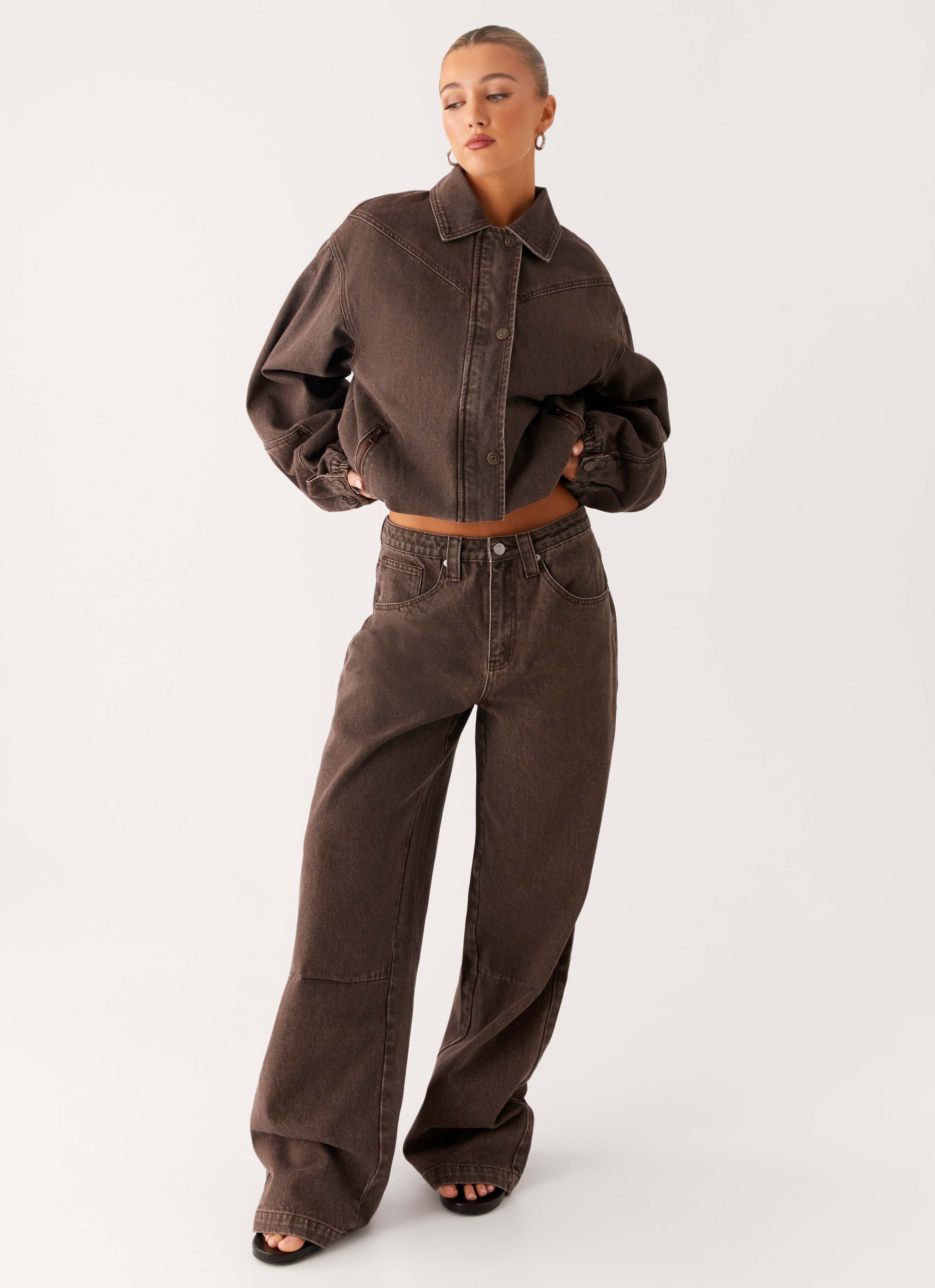 Women's brown washed denim bomber jacket with shirt collar and zip pockets
