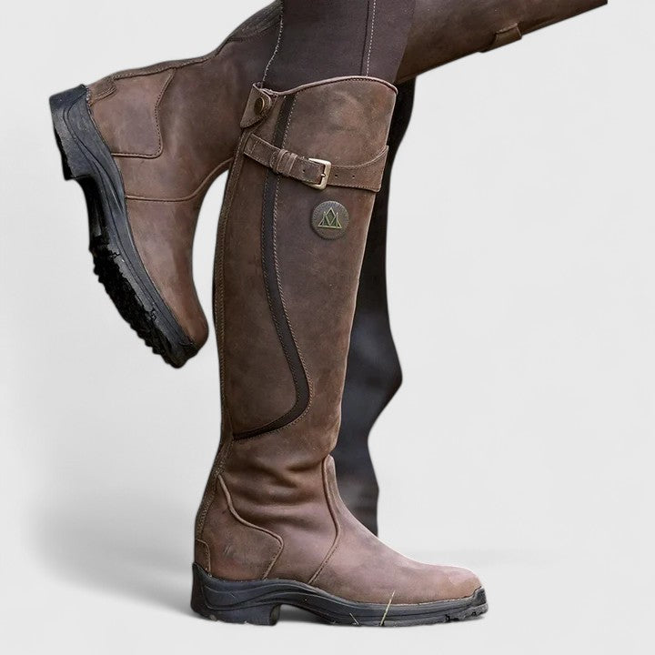 Tall winter boots with buckle straps and low heels