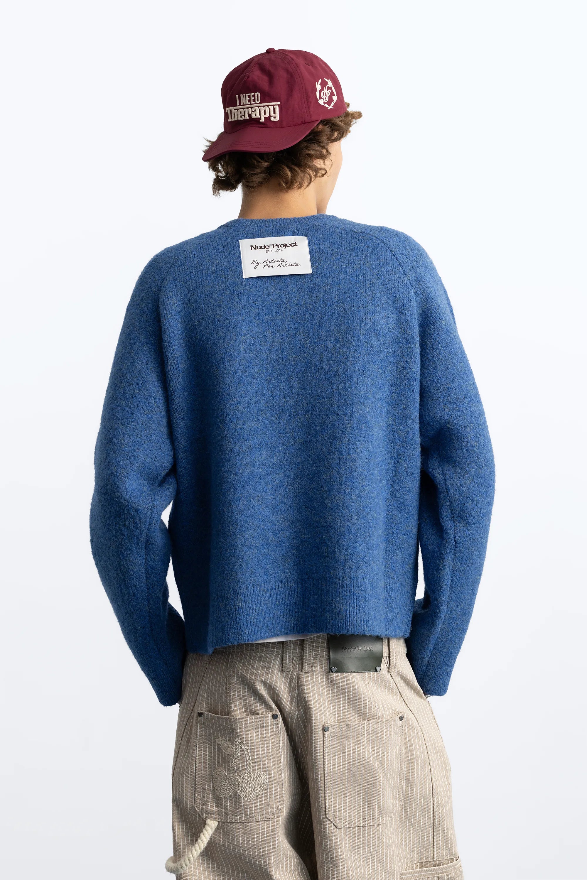 Women's blue crew-neck knit sweater with chest emblem