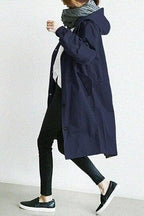 Women's hooded trench coat with button front and angled pockets