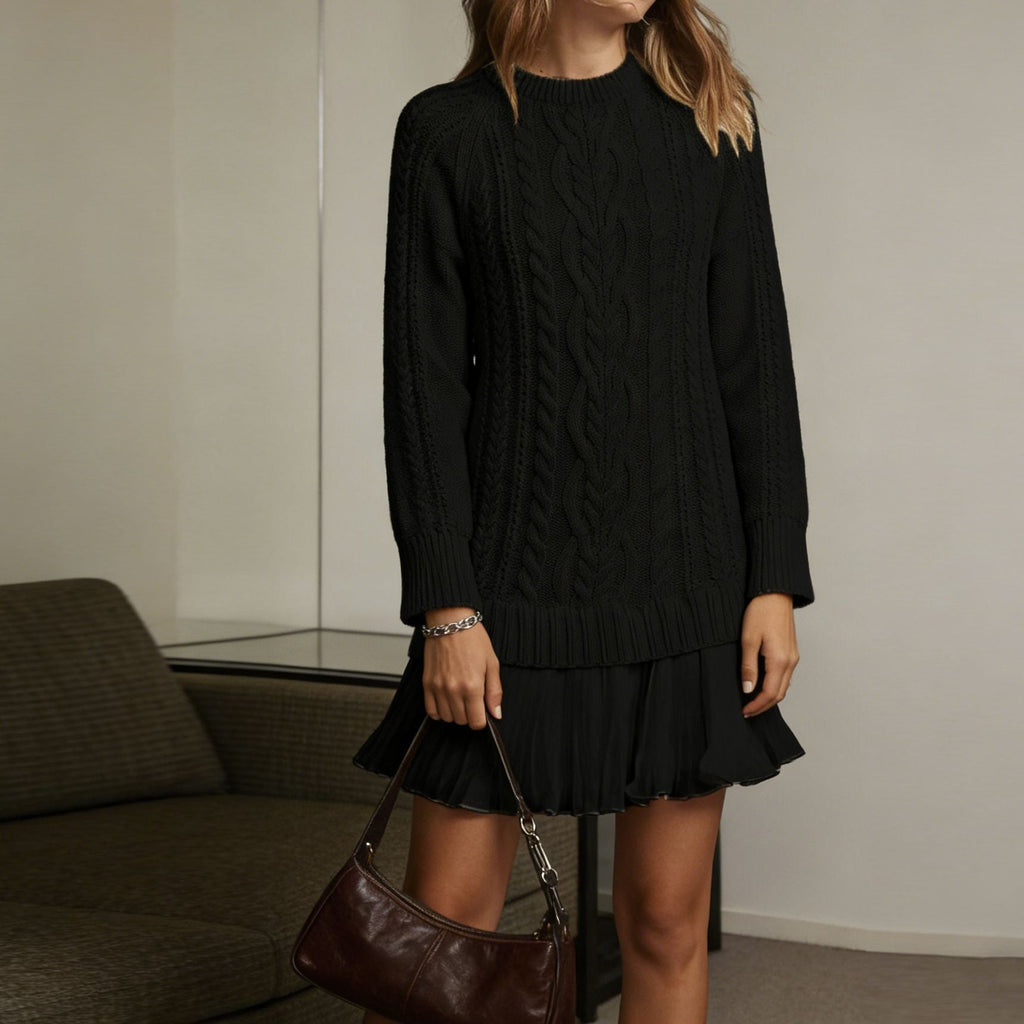 Women's long-sleeve cable knit sweater with a crew neckline and ribbed trims