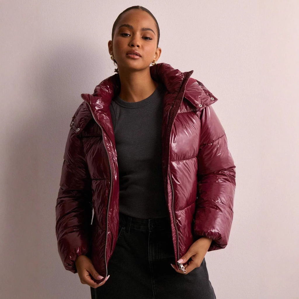 Women's shiny quilted hooded puffer jacket with leopard cuffs