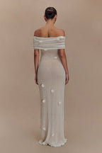 Women's off-shoulder knit maxi dress with decorative rosettes