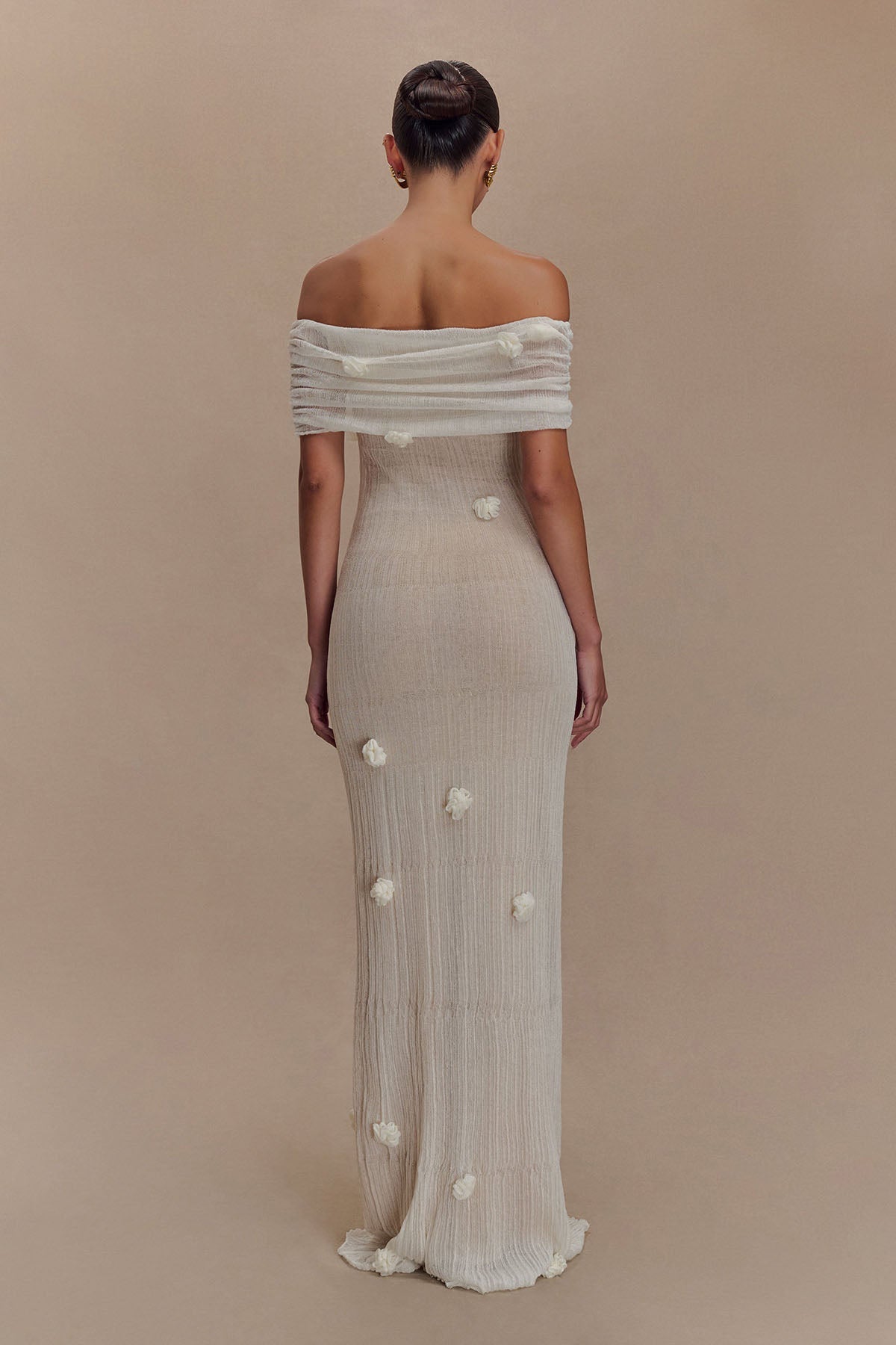 Women's off-shoulder knit maxi dress with decorative rosettes