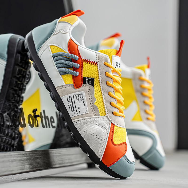 Colourblock utility trainers with layered panels and lace-up fronts