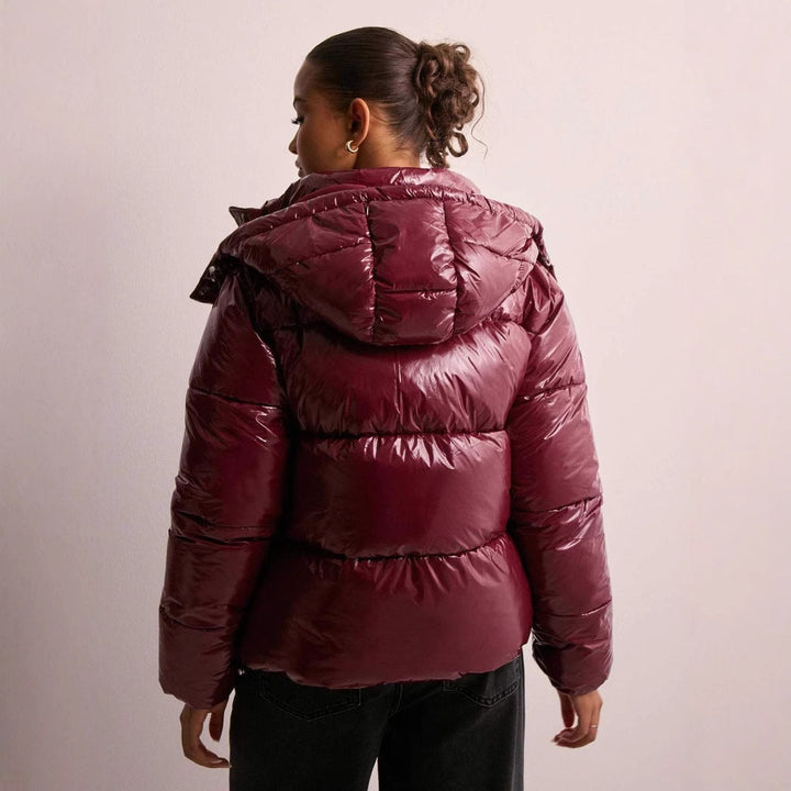 Women's shiny quilted hooded puffer jacket with leopard cuffs