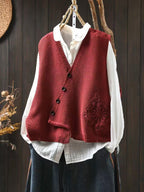 Women's knitted V-neck waistcoat with button front and floral panel