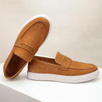 Men's penny loafers with moc toes, strap detail and white flat soles