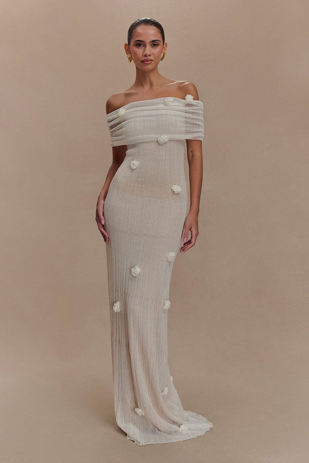 Women's off-shoulder knit maxi dress with decorative rosettes