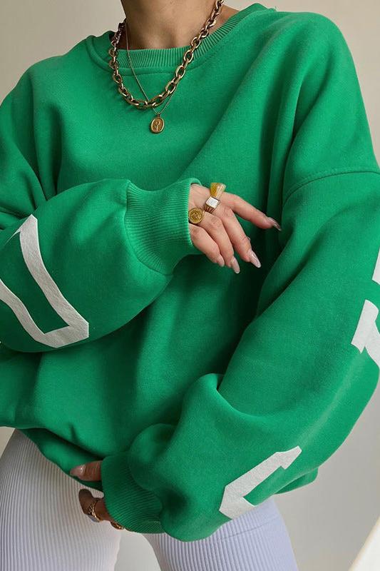 Women's crew-neck sweatshirt with contrasting letter graphics on the sleeves
