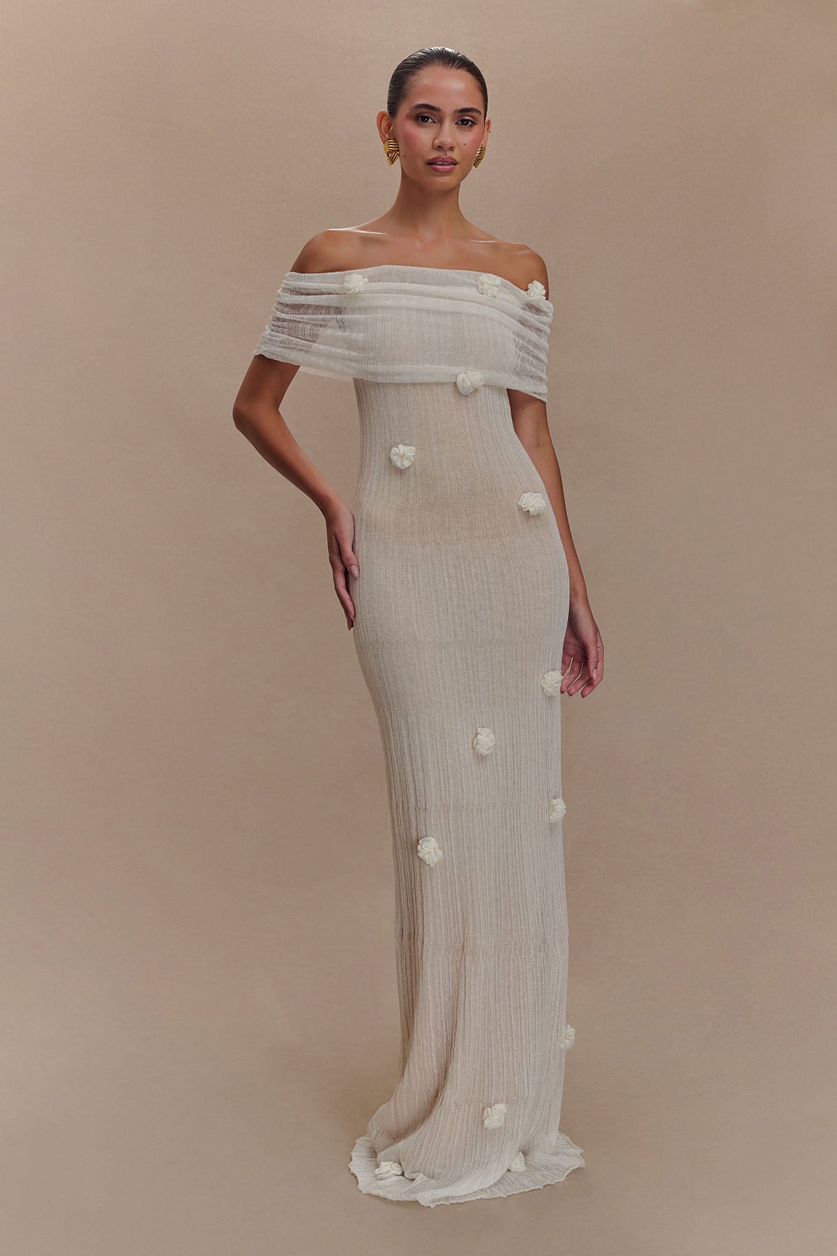 Women's off-shoulder knit maxi dress with decorative rosettes