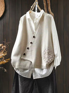 Women's knitted V-neck waistcoat with button front and floral panel