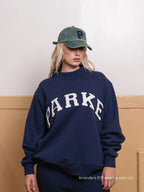 Women's oversized sweatshirt with mock neck, long sleeves and varsity lettering