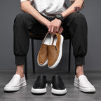 Textured slip-on loafers with rounded toes and flat soles