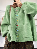 Women's green boxy cardigan with V-neck, colourful buttons and front patch pockets
