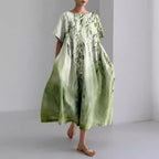 Women's loose floral midi dress with short sleeves and flared skirt
