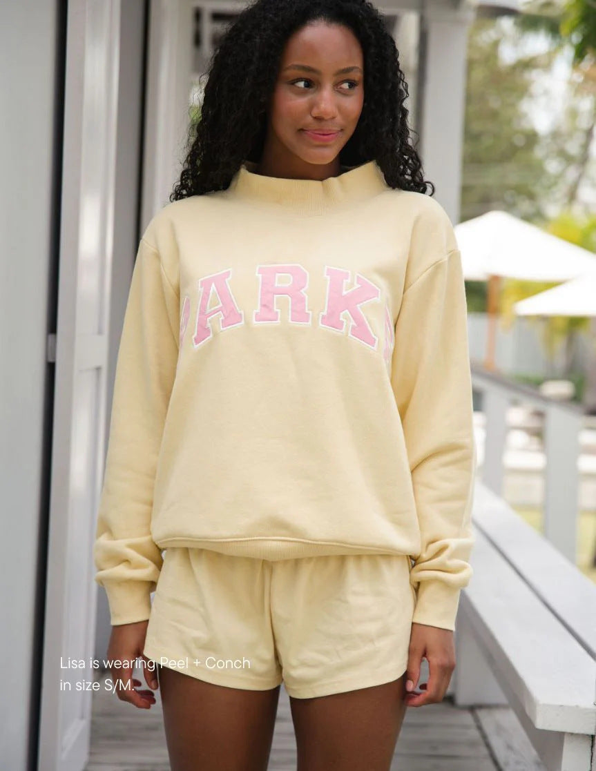 Women's oversized sweatshirt with mock neck, long sleeves and varsity lettering