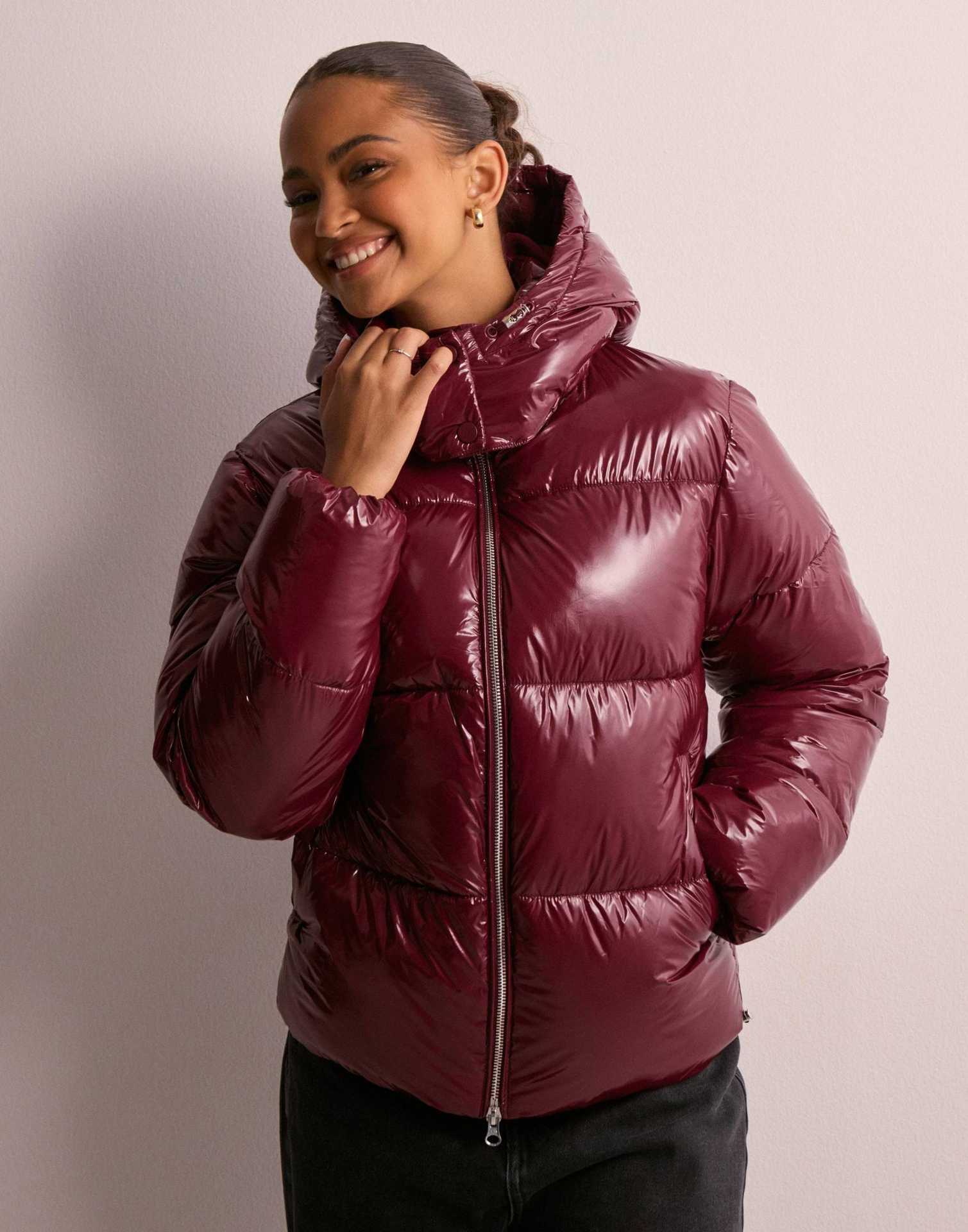 Women's shiny quilted hooded puffer jacket with leopard cuffs