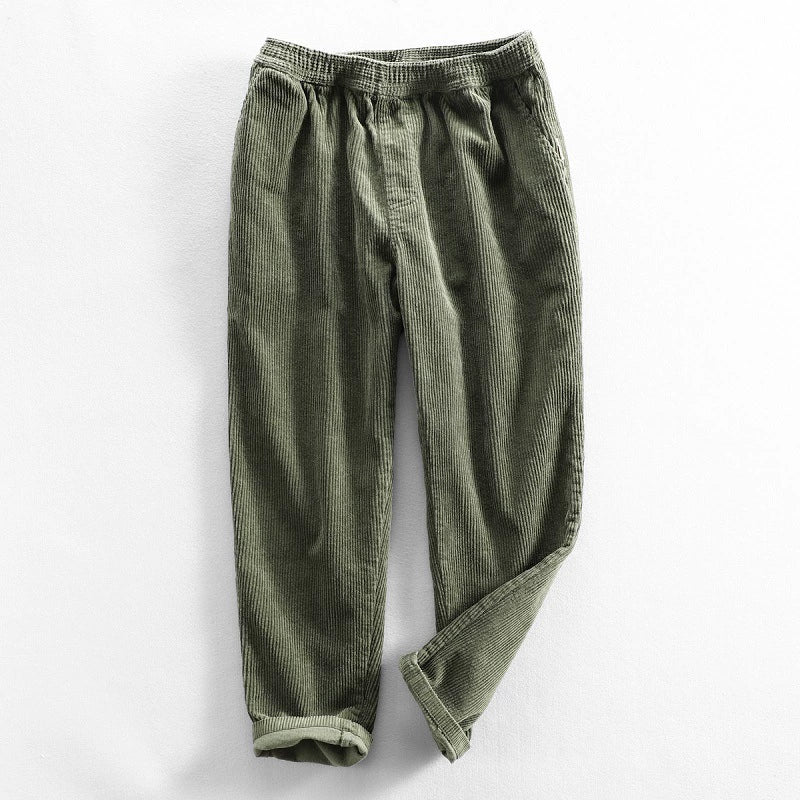 Unisex ribbed corduroy trousers with elasticated waist, side pockets and turned-up hems