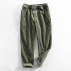 Unisex ribbed corduroy trousers with elasticated waist, side pockets and turned-up hems