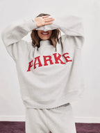 Women's oversized sweatshirt with mock neck, long sleeves and varsity lettering
