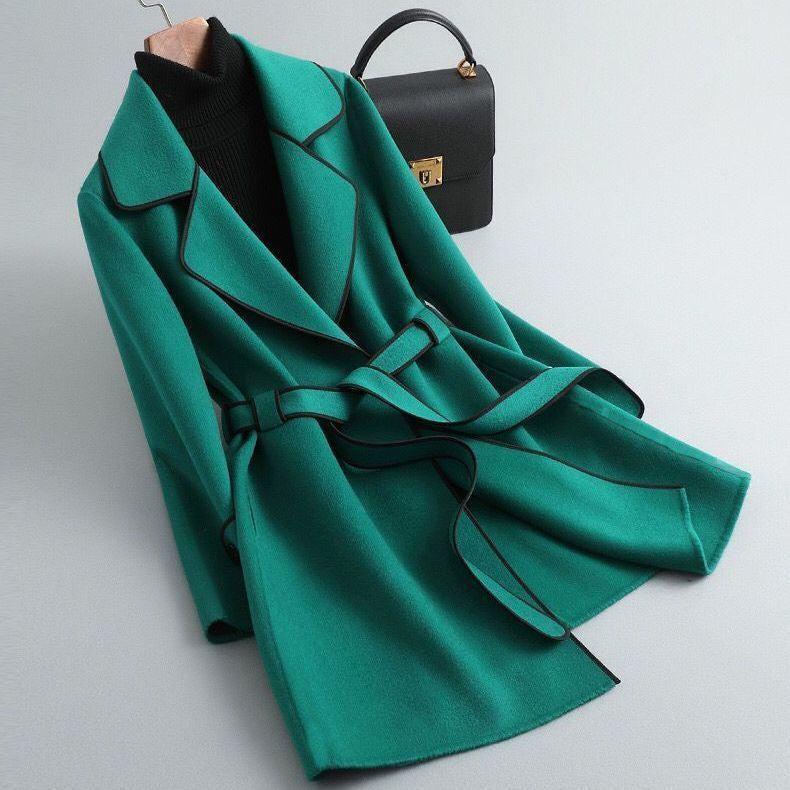 Women's long-sleeved belted trench coat with contrast piping and buttoned cuffs