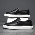 Textured slip-on loafers with rounded toes and flat soles