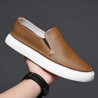 Textured slip-on loafers with rounded toes and flat soles
