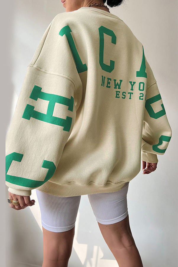 Women's crew-neck sweatshirt with contrasting letter graphics on the sleeves