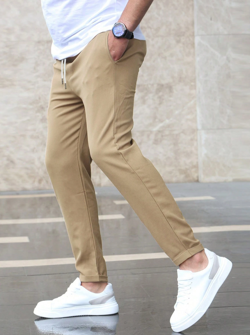 Men's slim fit jogger pants with drawstring waist and tapered cuff in grey